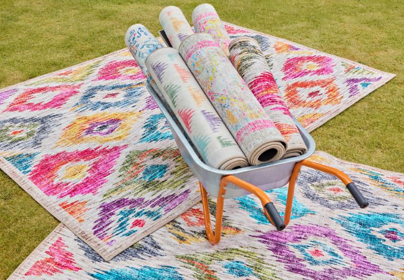 phoenox textiles eco-washable rugs collection in wheel barrow