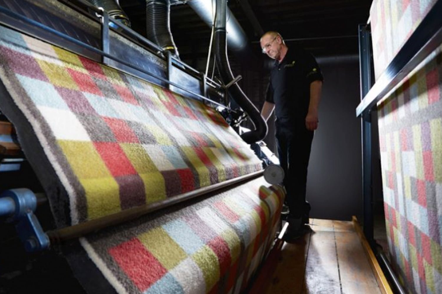 Worker at Phoenox Textiles working on the shearing machine