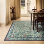 Sanderson By Highgrove x Hug Rug Eco-Washable Ancient Apple Tree Midnight with apple tree design, styled on wooden flooring.