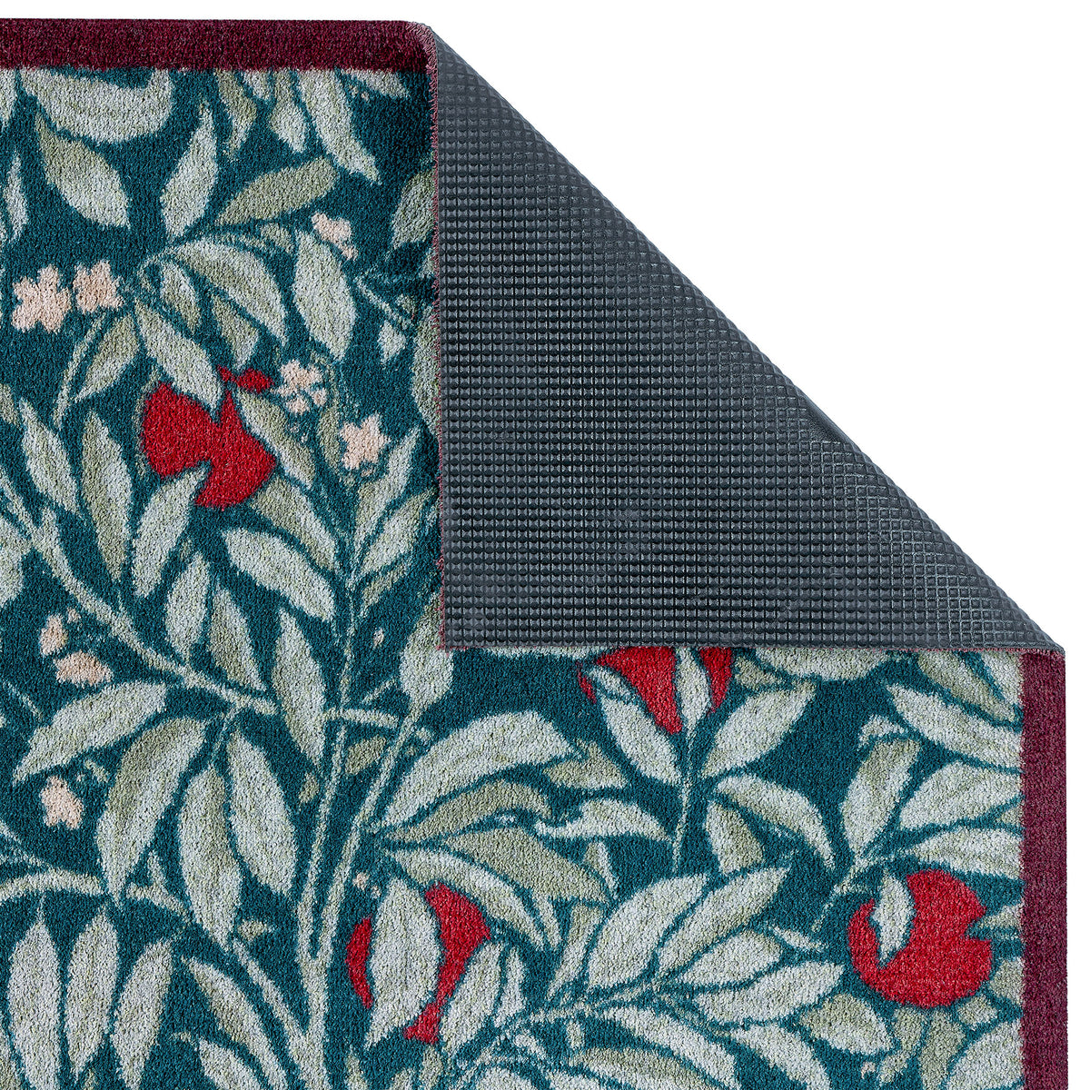 Sanderson By Highgrove x Hug Rug Ancient Apple Tree Midnight with an apple tree design showing rubber backing.