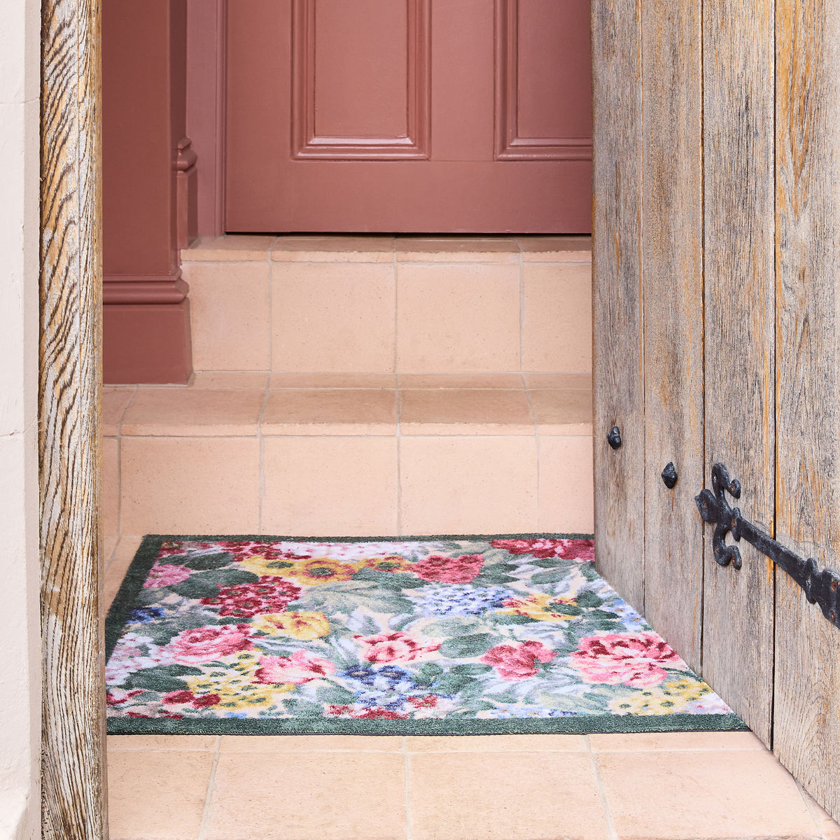 Sanderson By Highgrove x Hug Rug Antique Hydrangea & Rose with a floral design, styled by tile steps.