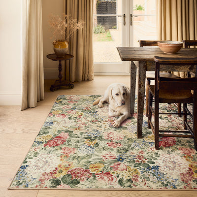 Sanderson By Highgrove x Hug Rug Antique Hydrangea & Rose with a floral design, styled on wooden flooring.
