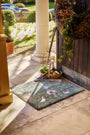 Hug Rug X Sally Swannell Ducks Doormat styled in a doorway 