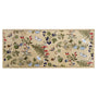 A rectangular runner with a beige background and a whimsical woodland pattern featuring rabbits, squirrels, acorns, berries, ferns, and small birds in green, blue, red, and brown.