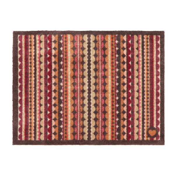 A rectangular doormat with a multicolor Southwestern-style geometric pattern featuring vertical stripes of red, orange, brown, beige, and cream, finished with a dark brown border.