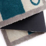 Bone Stripe Teal- 100% recycled cotton doormat featuring a striped pattern with a bone in the centre.