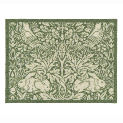 A rectangular outdoor doormat featuring a classic William Morris-style botanical and animal pattern with green and cream rabbits, birds, and foliage, shown flat against a white background.