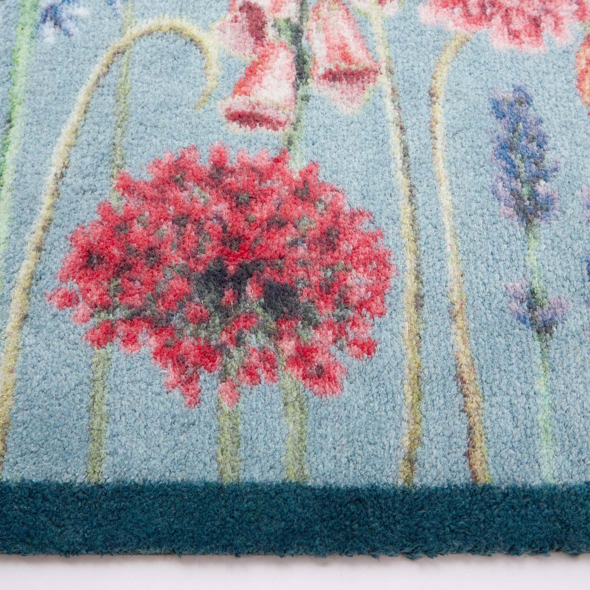 Butterfly Garden Blue Detail- Made from 100% recycled cotton featuring a wildflower garden and butterflies.