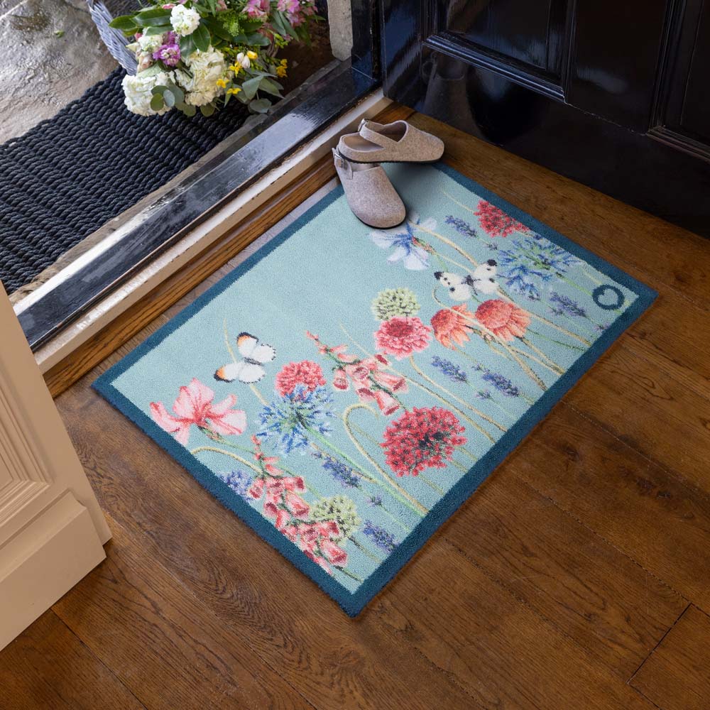 Butterfly Garden Blue Doomat- 100% recycled cotton doormat featuring a wildflower garden and butterflies.