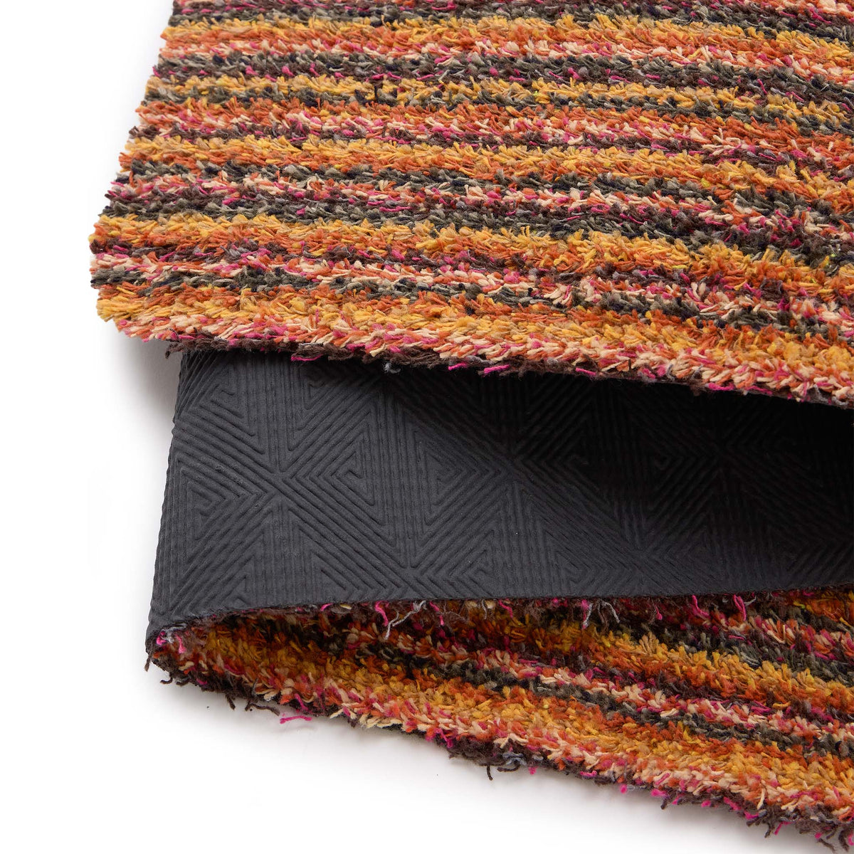Candy Spring Stripe- 100% recycled content doormat featuring a bright striped design.