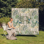 Sanderson By Highgrove x Hug Rug Eco-Washable Carpet Garden Sanctuary with a nature inspired pattern, styled in a garden.