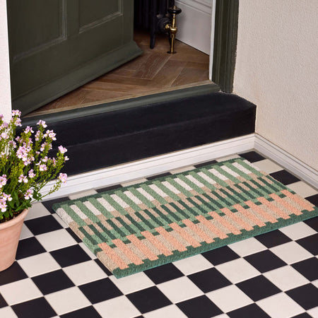 Pastel Broken Stripe. Made from 100% coconut husk fibres featuring a pink and green broken stripe design.