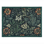 A rectangular outdoor doormat with a dark green border and a dense floral and botanical pattern in muted green, beige, orange, and white on a dark background.