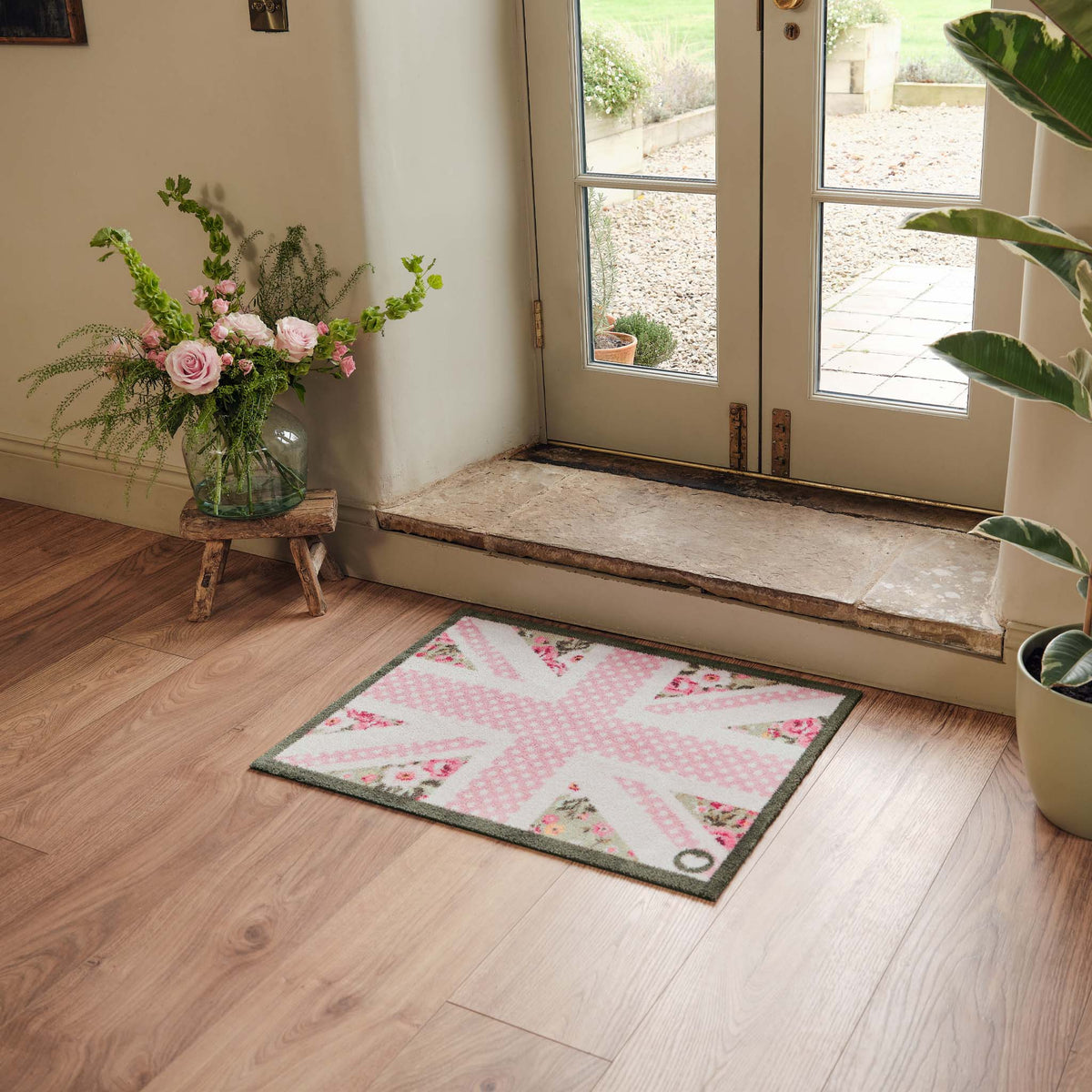 Country Rose Flag Doormat- 100% recycled cotton doormat featuring a pink union jack flag surround by florals.