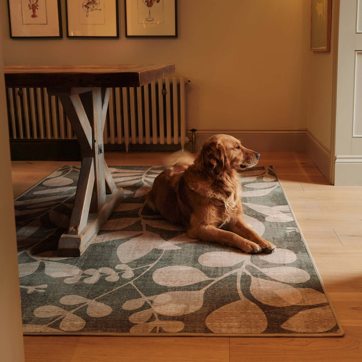 Eden Leaves Green- 100% recycled material rug featuring white florals against a green background.