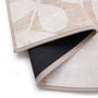 Eden Leaves Natural- 100% recycled material rug featuirng white florals against a natural background.