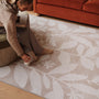 Eden Leaves Natural- 100% recycled material rug featuirng white florals against a natural background.