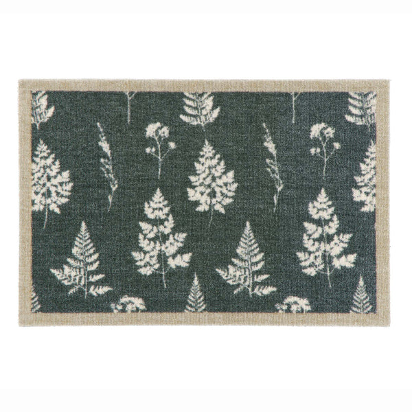 A rectangular doormat with a dark green background featuring a repeating pattern of white ferns and a natural beige textured border.