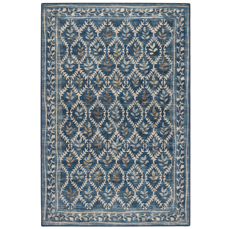 A rectangular area rug with a traditional ikat-style pattern in shades of blue, beige, and muted brown, shown flat against a white background.