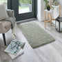 Howler and scratch shaggy green fleck rug with a green shaggy pile. Styled in a doorway.