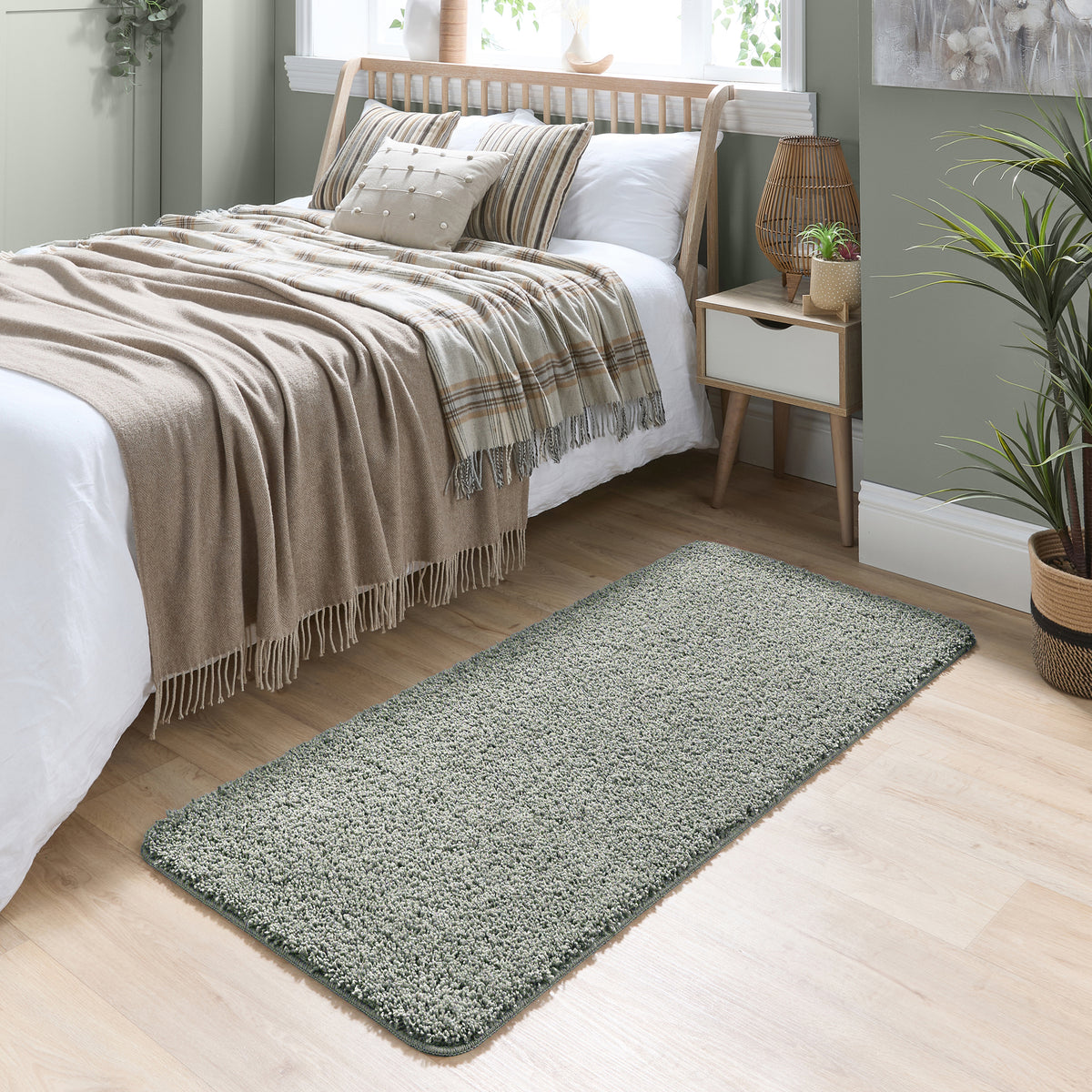 Howler and scratch shaggy green fleck runner with a green shaggy pile. Styled by the bed.