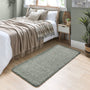 Howler and scratch shaggy green fleck runner with a green shaggy pile. Styled by the bed.