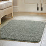 Howler and scratch shaggy green fleck rug with a green shaggy pile, styled on tiled floor.