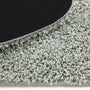 Close-up of Howler and scratch shaggy green fleck rug detail image.