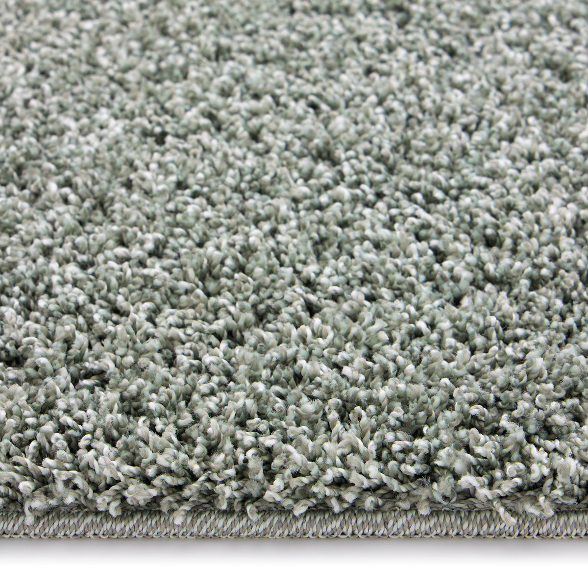 Close-up of Howler and scratch shaggy green fleck rug detail image.