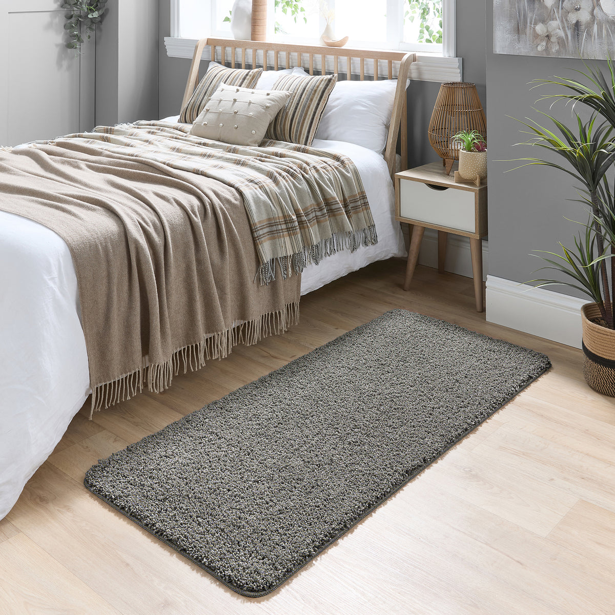 Howler & Scratch grey pet Shaggy mat styled in a bedroom. 