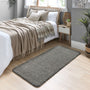 Howler & Scratch grey pet Shaggy mat styled in a bedroom. 