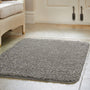 Howler & Scratch grey pet Shaggy mat styled on tiled floor. 
