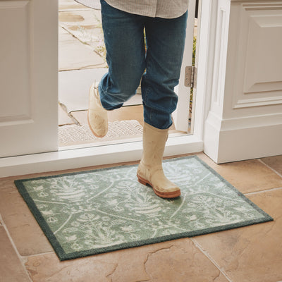 Sanderson By Highgrove x Hug Rug Highgrove Damask Silver Green with a traditional style pattern, styled on tile flooring.