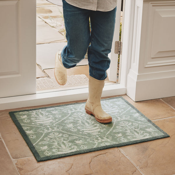 Sanderson By Highgrove x Hug Rug Highgrove Damask Silver Green with a traditional style pattern, styled on tile flooring.