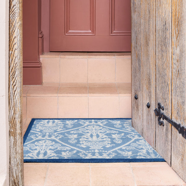 Sanderson By Highgrove x Hug Rug Highgrove Damask Tetbury Blue with a tradtional style pattern, styled on tiled flooring.