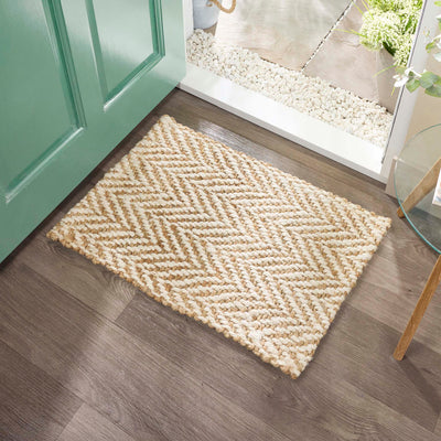 Origins Jute Herringbone Doormat with a herringbone woven design, styled in a doorway.