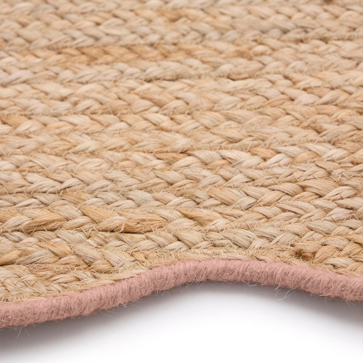 Jute Scalloped Edge Peach Rug- A jute rug with a pink wool wipped edge border.