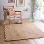 Jute Scalloped Edge Peach Rug- A jute rug with a pink wool wipped edge border.