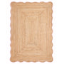 Jute Scalloped Edge Peach Rug- A jute rug with a pink wool wipped edge border.