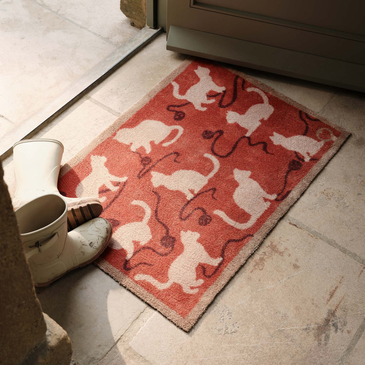 Kitty Cat Rust Doormat- 100% recycled cotton doormat featuring cats playing with yarn.