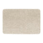 A rectangular shag rug in a light beige or cream color, shown from a top-down view on a solid white background.