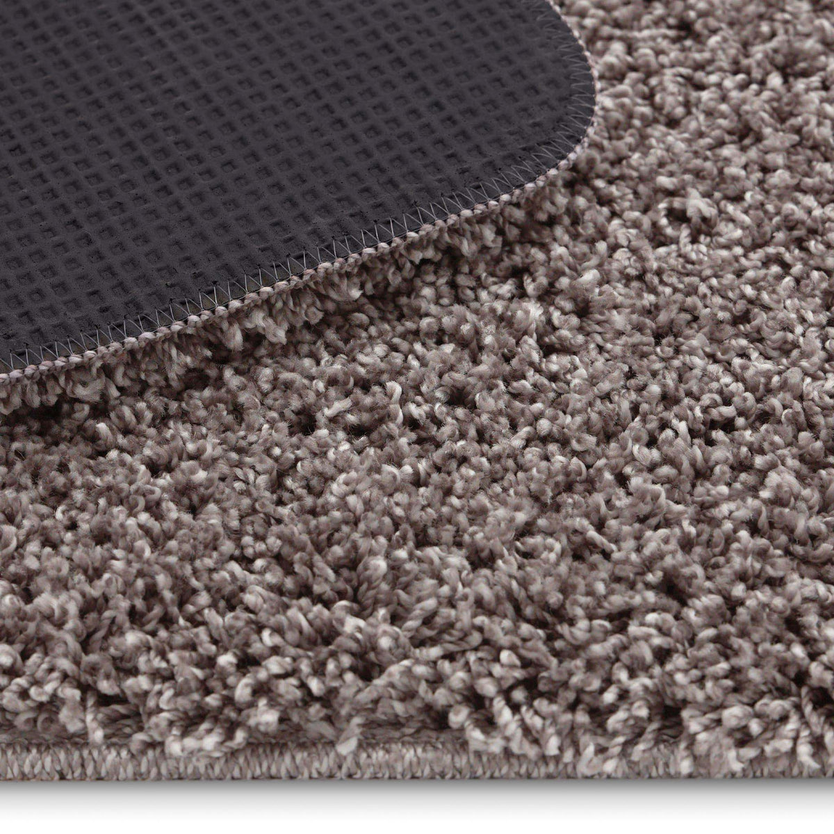 Detail image of Howler and scratch shaggy pet mat in mocha brown. 