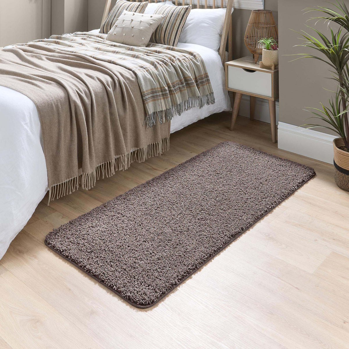 Howler and scratch shaggy pet mat in mocha brown styled in a bedroom. 