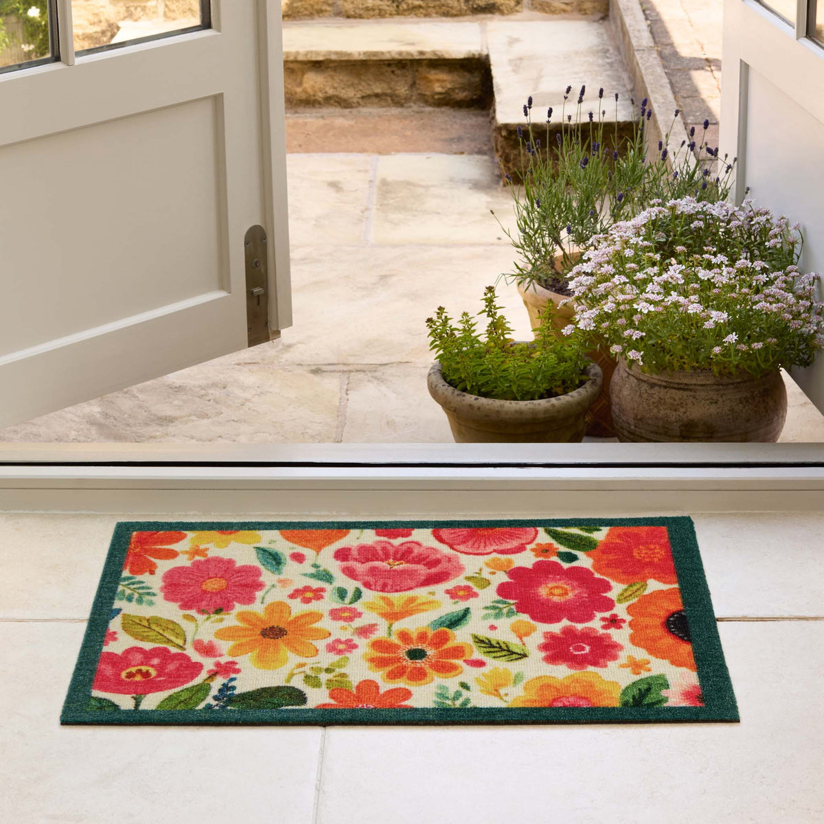 My Bright Blooms- 100% Nylon doormat featuring yellow, red and pink blooms.