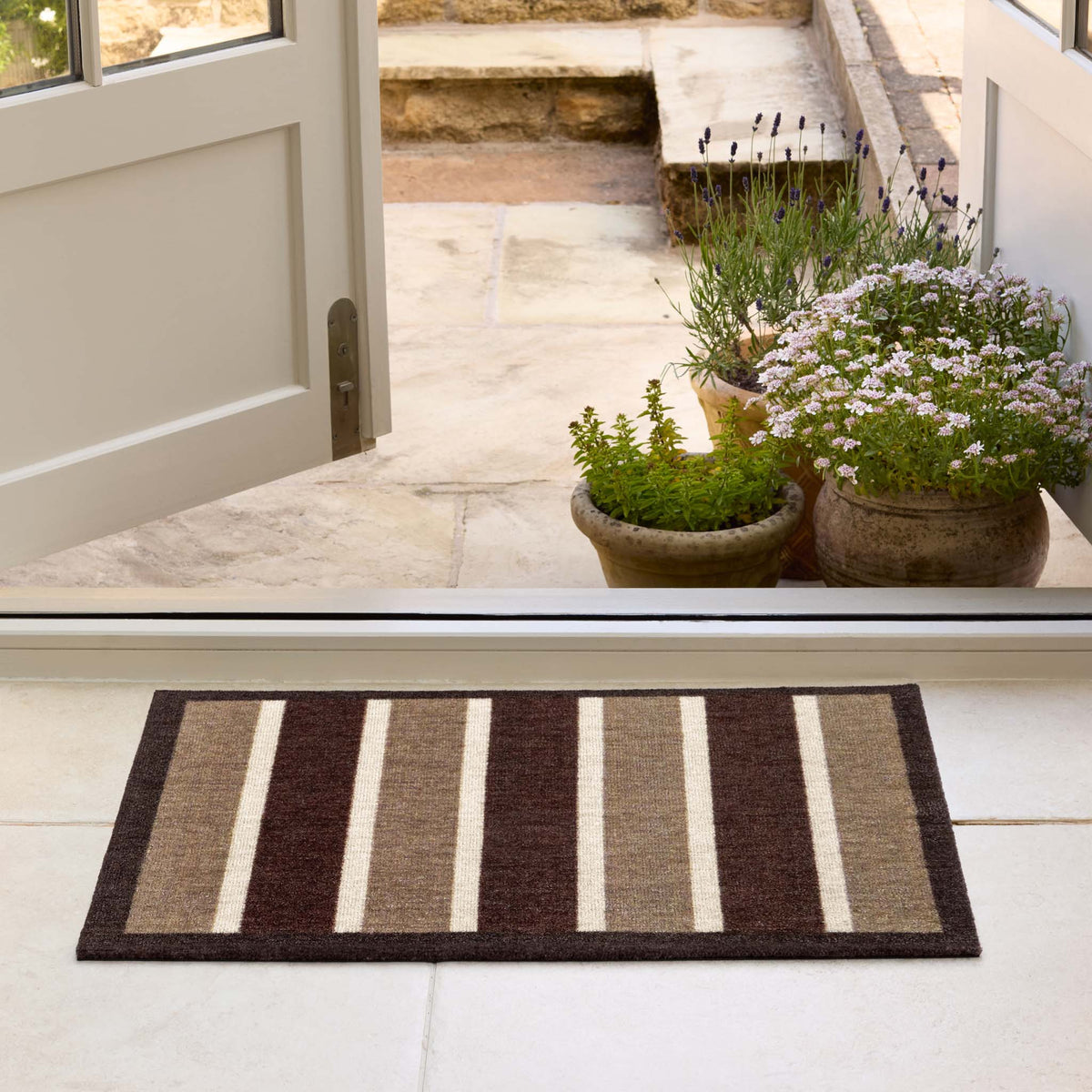 My Choclate Stripe- 100% recycled nylon doormat featuring brown and white stripes.
