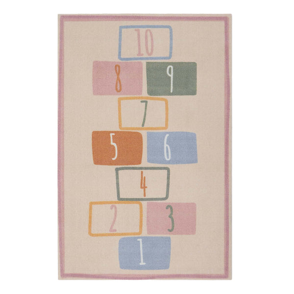 Children's rug with colorful number blocks on a beige background