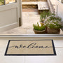My Welcome Linear- 100% nylon doormat featuring the word 'welcome' against a cream background.