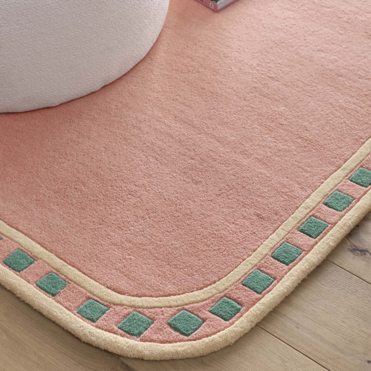 Borderline Pink Rug- 100% wool rug in pink with a geometric border.