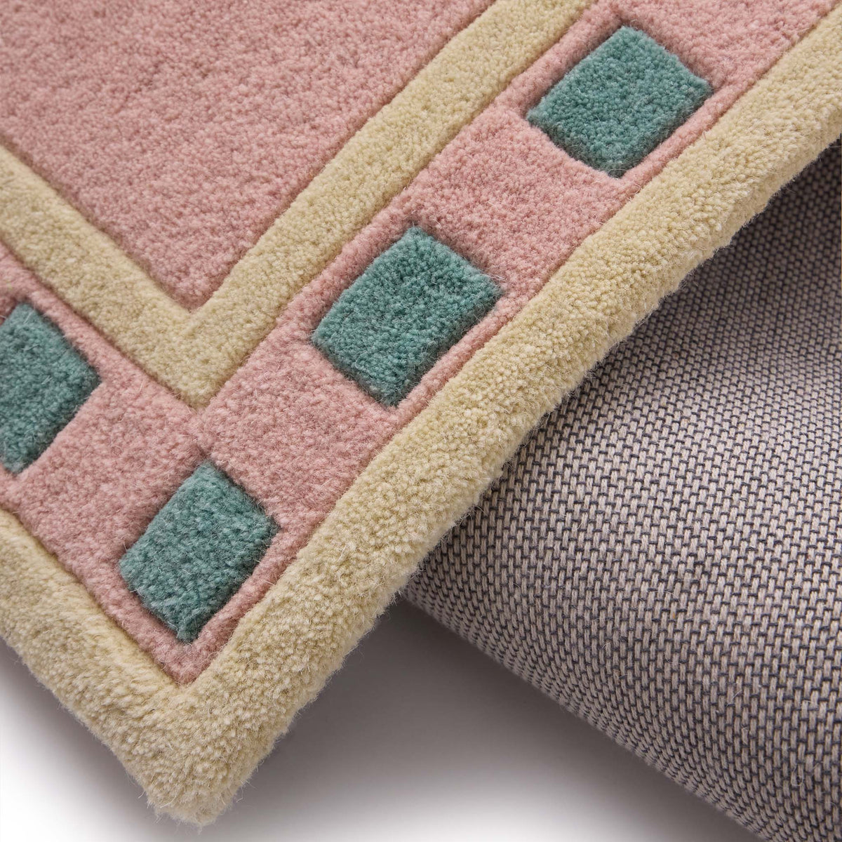 Borderline Pink Rug- 100% wool rug in pink with a geometric border.