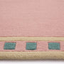Borderline Pink Rug- 100% wool rug in pink with a geometric border.